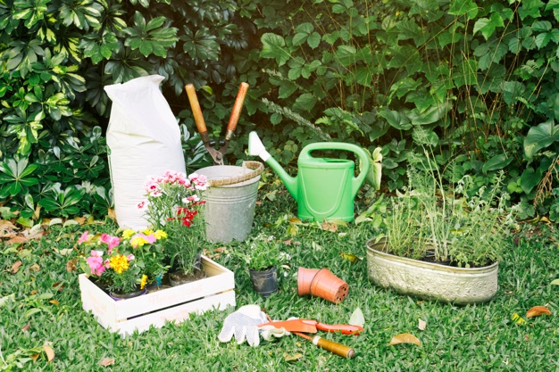 gardening-inventory-with-flowerpots-grass_23-2148028921