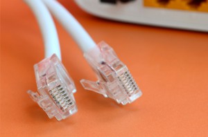internet-router-internet-cable-plugs-lie-bright-orange-background_76080-834